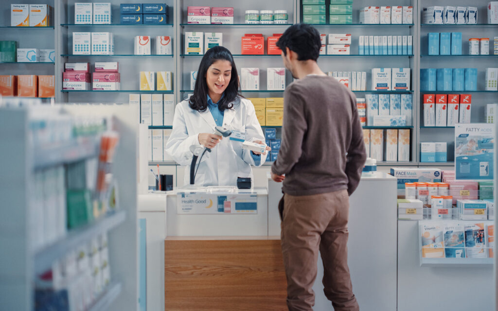 Pharmacist Discussing Medication With Customer